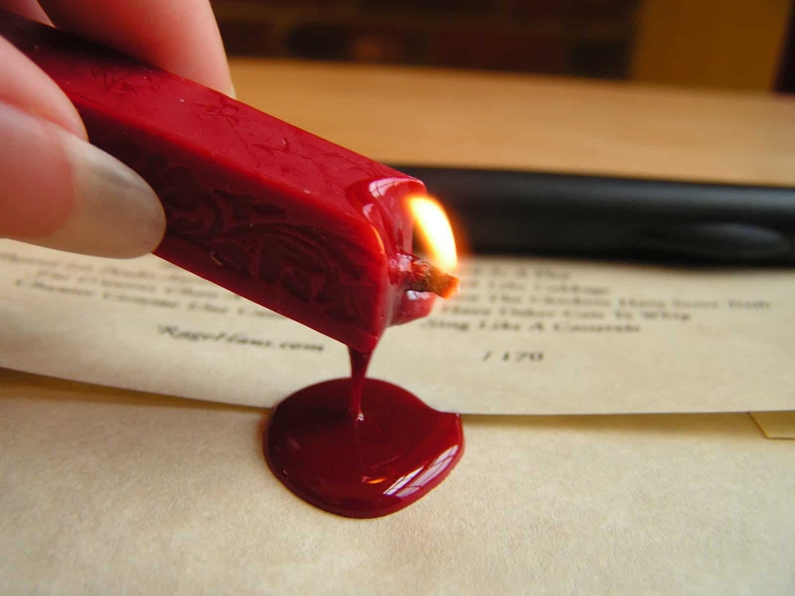 Lighting and pouring red sealing wax onto parchment